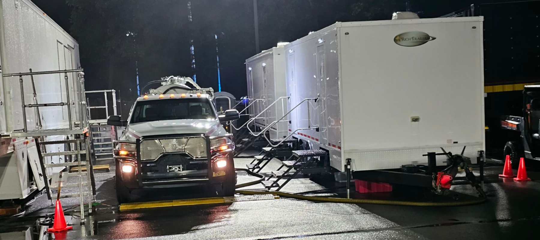 Luxury restrooms setup outdoors at night.